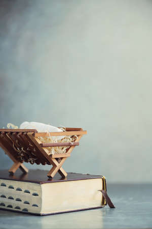 Wooden rack with Holy bible background.の写真素材
