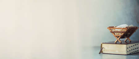 Wooden rack with Holy bible background.の写真素材