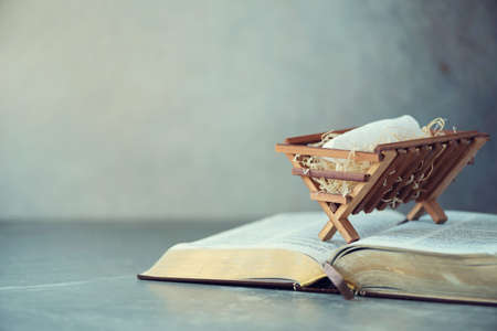 Wooden rack with Holy bible background.の写真素材