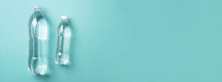 Water balance. Pure water in bottle for healthy lifestyle on blue background. Top view. Copy space. World water day. Pollution, environmental protection concept. Global water crisis and problemの写真素材