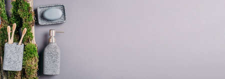 Zero waste, plastic free, sustainable concept. Bamboo bath accessories - soap dish, soap dispenser, tooth brush, organic dry shampoo for personal hygiene on green moss texture. Copy space. Top view.の写真素材