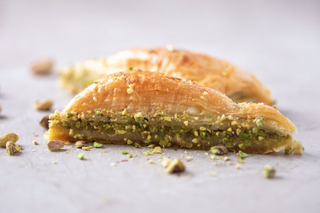 Turkish dessert baklava with pistachios on grey background. Top view. Copy space. Set of assorted traditional eastern desserts. Arabian sweets, turkish delight.の写真素材