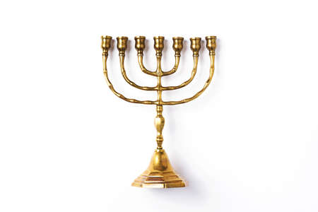 Golden hanukkah menorah on isolated on white background. Jewish holiday banner with copy space. Ancient ritual religious candle menorahの写真素材