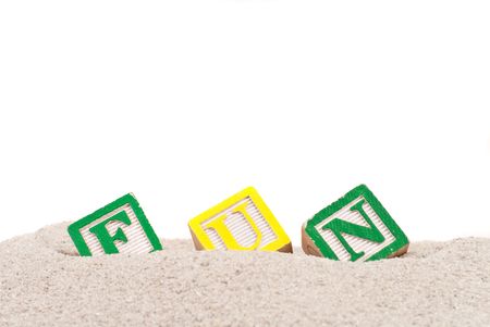 Fun Spelled Out on Sandの写真素材