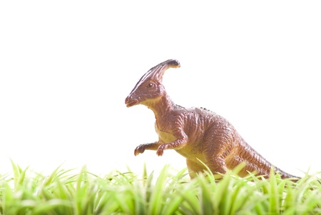 Toy Dinosaur in Grass の写真素材