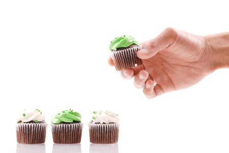 Choosing the Green Frosted Cupcakeの写真素材