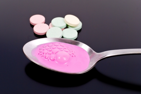 Tablespoon of Pink Medicine with Antacidsの写真素材