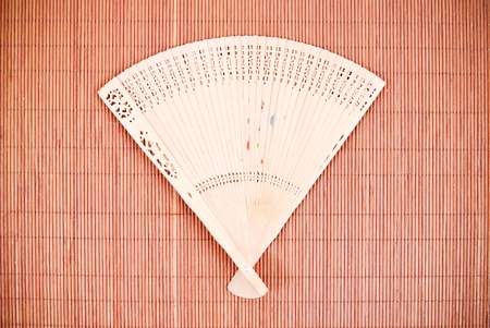 Asian Fan on Bamboo Matの写真素材