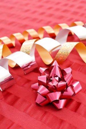 Red Bow with Silver and Gold Ribbonsの写真素材