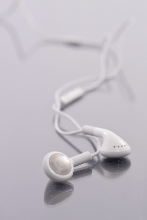 Headphones on Reflective Surfaceの写真素材