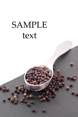 Peppercorn and Spoon with Space for Textの写真素材