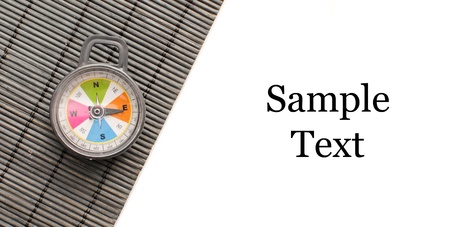 Compass on Black Bamboo Surface with Space for Custom Text