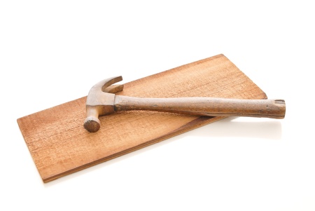 Old Vintage Wooden Hammer on a Plank of Woodの写真素材