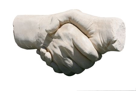 stone handshake sculpture isolated on white backgroundの写真素材