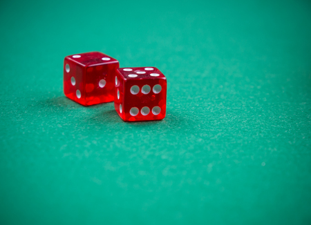 cubes on casino green felt poker tableの写真素材