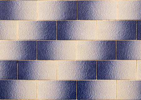 tile wall background on house facade in Algarve Portugal, texture