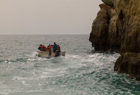 Benagil, Algarve, Portugal. OCT 18, 2017. Boat trips. Tourist visit in boats to travel the coast entering the caves of Benagil with the boat.のeditorial素材