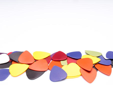Guitar picks isolated on white background with space for textの写真素材