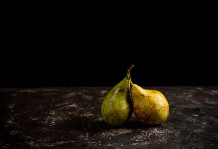  two pears in black background with copy spaceの写真素材