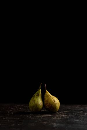  two pears in black background with copy spaceの写真素材