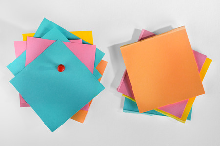Pile of blank colorful paper notes with pin on white background の写真素材