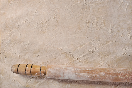Customizable cooking recipe setup, homemade baking dough and a rolling pin, top view の写真素材