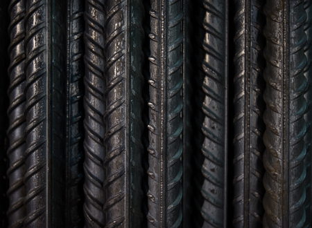 Artistic steel bars closeup, reinforcement on construction site, editable background. Steel bars or rods used on construction sites for concrete layering.の写真素材