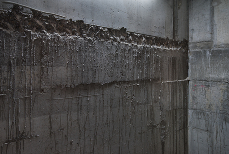 Raw concrete walls, suitable for background use, corner view.