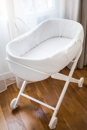 Nice white cradle for babyの写真素材