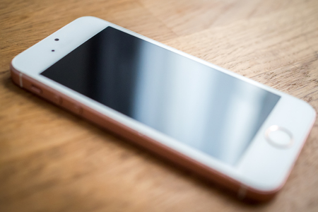 Modern Elegant Smart Phone on a deskの写真素材