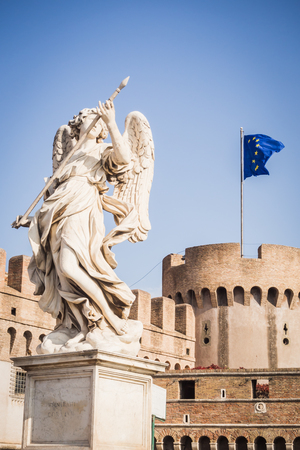 Statue of an angel in front of the castle of Rome Italy with the European flag, Europeのeditorial素材