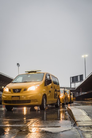 NEW YORK, USA - FEBRUARY 22, 2018: New York Yellow Taxi Queue on Rainy Day at JFK Airportのeditorial素材