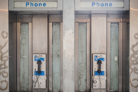 NEW YORK, USA - FEBRUARY 23, 2018: Old phone booths on the streets of Manhattan in New Yorkのeditorial素材