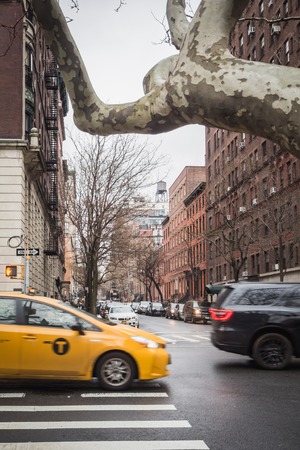 NEW YORK, USA - FEBRUARY 23, 2018: Yellow cab in the residencial streets of Manhattan in New Yorkのeditorial素材