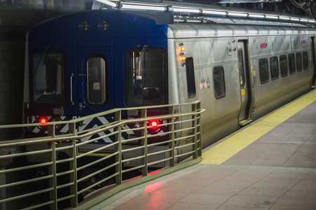 Train parked in at a dock before leaving at Grand Central Station in Manhattan New Yorkのeditorial素材