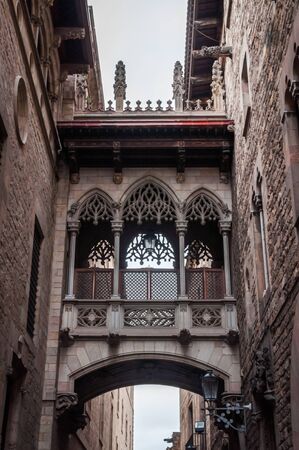 The Bridge of Carrer del Bisbe, the clone of the Bridge of Sighs of Venice in the heart of the Gothic Quarter of Barcelonaの写真素材