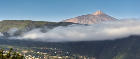 The city of Santa Cruz de Tenerife under the mist of El Teide volcano