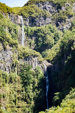 Huge waterfall in the middle of a levada in Madeiraの写真素材