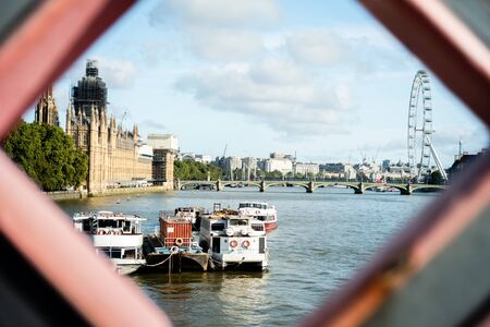 View of the Thames river, Big Ben in works and London Eye in Londonの写真素材