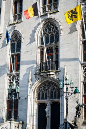 Belgian and European flags on the facade of the provincial palace in Bruges in Belgiumのeditorial素材