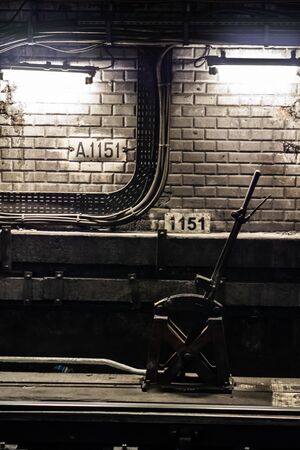 Choose your path, railway track change lever in a metro tunnel