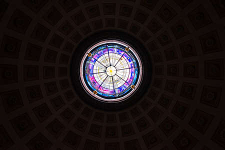 Monumental stained glass windows under the dome of a church in Rome, Italyのeditorial素材
