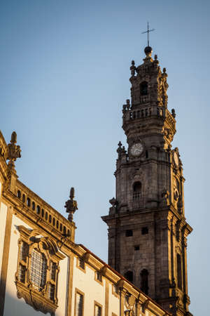 Sunset over the tower of the Clerigos Church in the center of Porto, Portugal