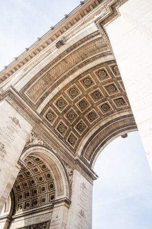 Under the arches of the Arc de Triomphe in Paris