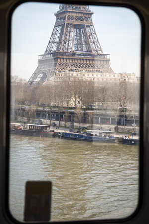 The Eiffel Tower seen from an elevated train in Paris - Seine river
