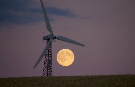 Windmill and lunar energy  in beautiful associationの写真素材