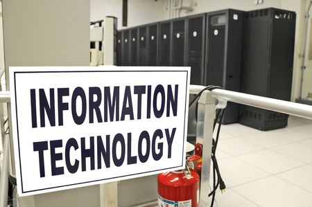 Information Technology data center room with data racks in the background