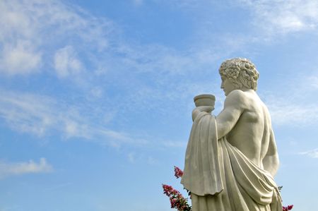 Stone carving of ancient roman soldier with blue sky backgroundの写真素材