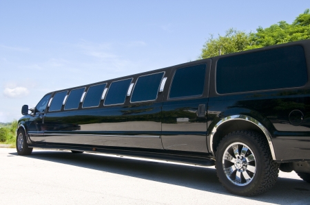 Black Stretch limousine waiting for guests to arriveの写真素材