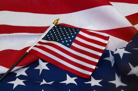 Miniature United States flag on larger flagの写真素材